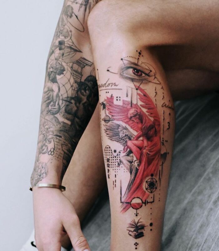Geometric tattoos on leg with red angel and eye design, showcasing intricate patterns and shapes.