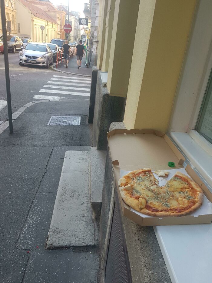 Someone Ordered A Blue Cheese Pizza And Left On The Street After Eating One Slice. Customer Review At Its Finest