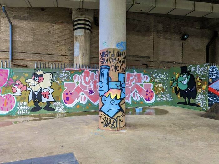 Colorful creative graffiti art on urban walls and pillars, showcasing vibrant street art that transforms blank surfaces into admired works.