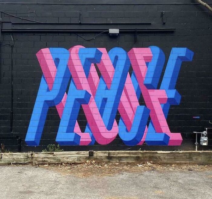 Colorful graffiti art spelling peace on a black wall, showcasing creative graffiti art that transforms blank walls.