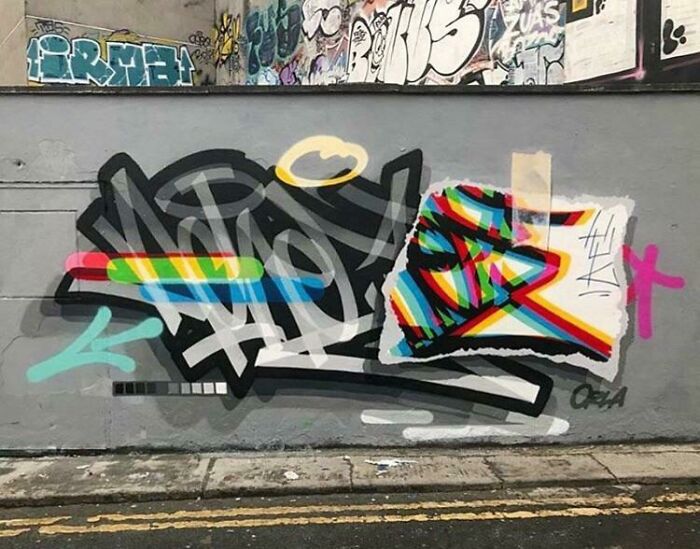 Colorful graffiti art featuring abstract shapes and stripes brightening a blank urban wall with creative street art designs.