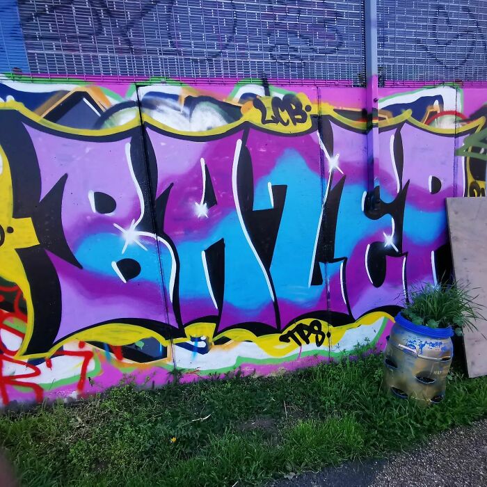 Colorful creative graffiti art on an urban wall, turning a blank surface into an admired street art masterpiece.