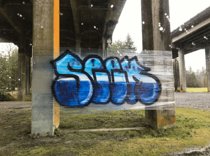 This Respectful Graffiti Artist Used Plastic Wrap For An Easy To Clean Up Tag