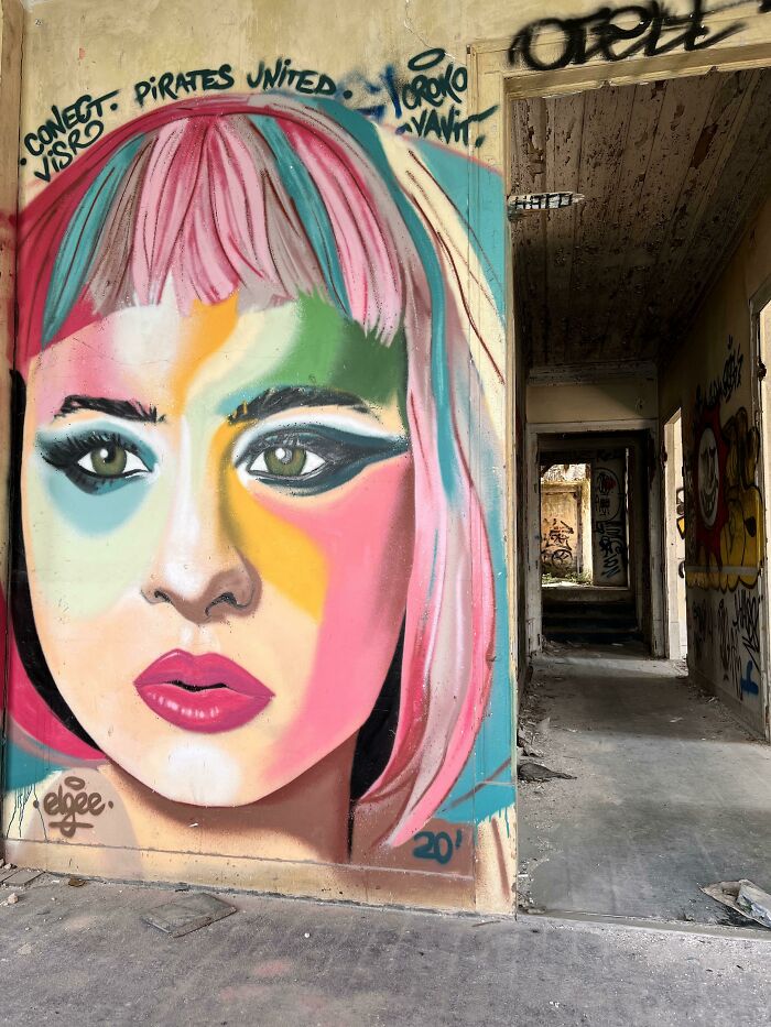 Graffiti On The Second Floor Of An Abandoned Riverfront In Almada, Portugal