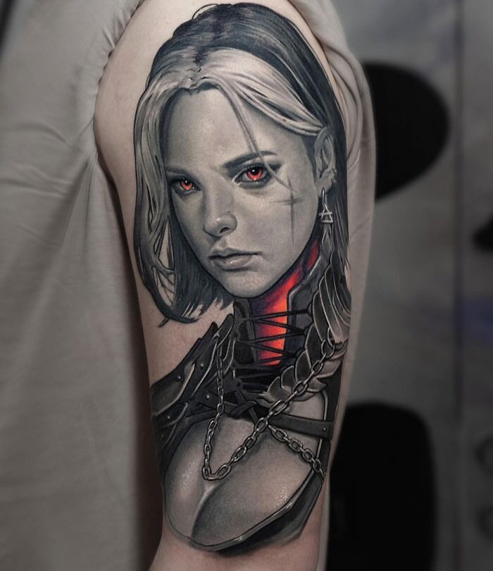 Super realistic tattoo of a woman with red eyes and detailed armor on an arm.
