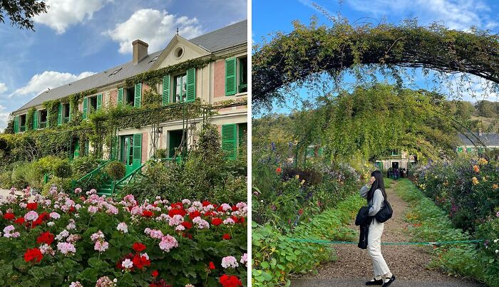 Lush colorful flowers and greenery surrounding a historic home and an archway in famous gardens under blue skies.