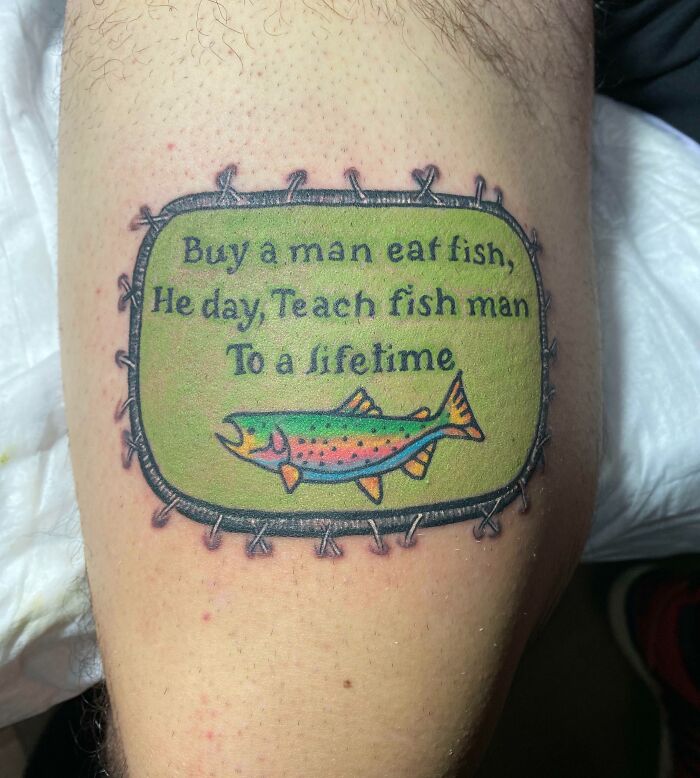 Colorful tattoo with a humorous fish-themed quote on skin, incorporating main word tattoos design.
