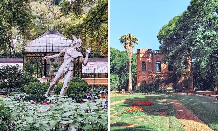 Statue in lush greenery and historic building surrounded by trees and landscaped famous gardens under clear blue sky