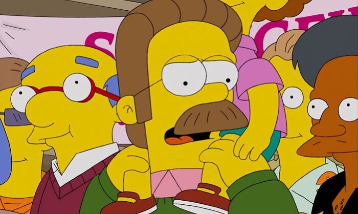 Ned holding a child on his sholder 