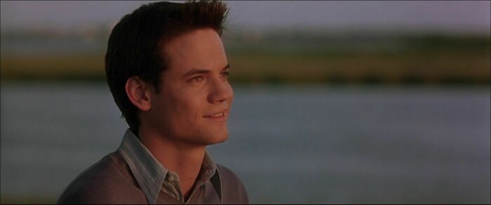 Landon wearing shirt and sweater on the top of it