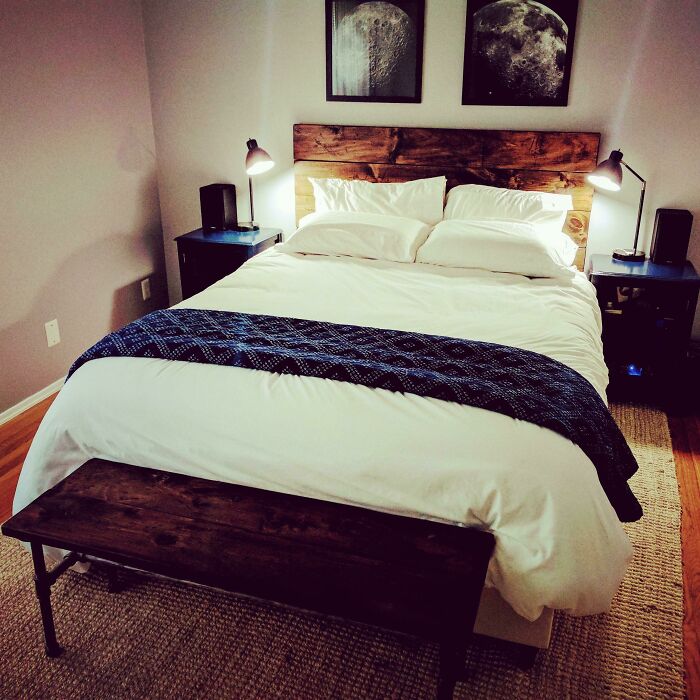 Cozy bedroom with wooden headboard, white bedding, and nightstands, highlighting home decoration ideas.