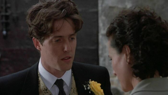 Charles wearing suit with yellow rose in the pocket 