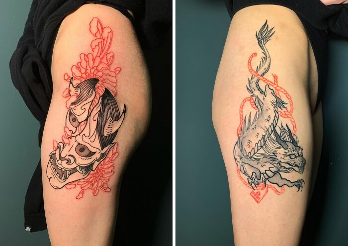 Red ink tattoos featuring a demon mask and dragon design on the arm.
