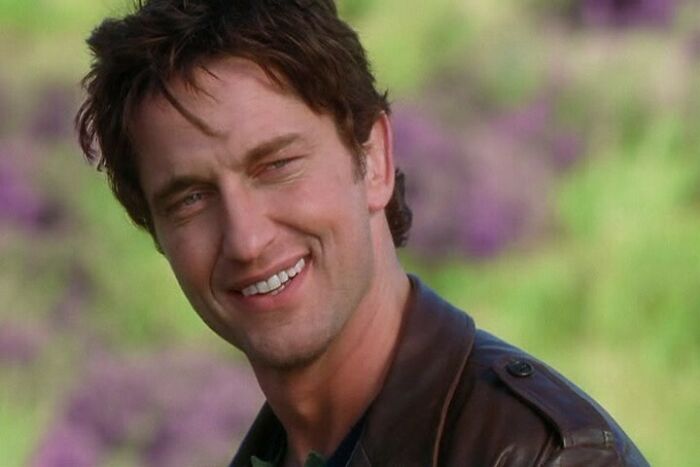 Daniel smiling wearing leather jacket 