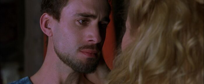 Viola touching William's face 