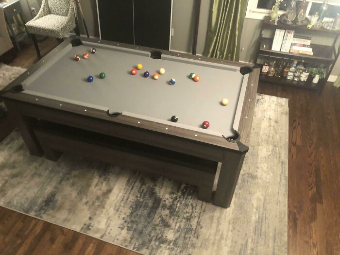 Pool table setup in a stylish room offering creative decoration inspiration.