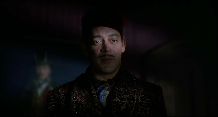 Gomez standing in the shadow 