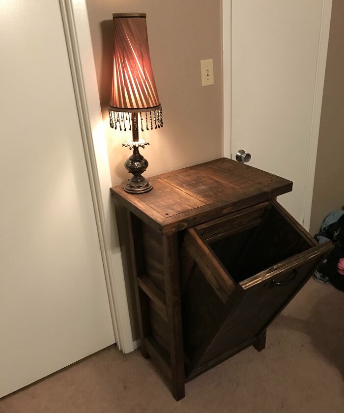 Creative inspiration with a wooden cabinet and a vintage lamp in a cozy interior setting.