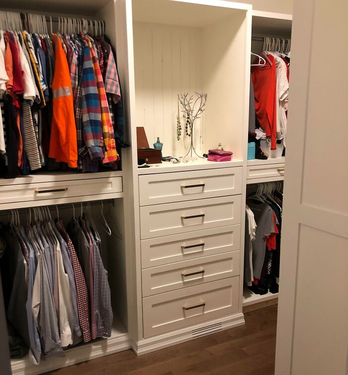 Creative inspiration in a well-organized closet with colorful shirts and white drawers.