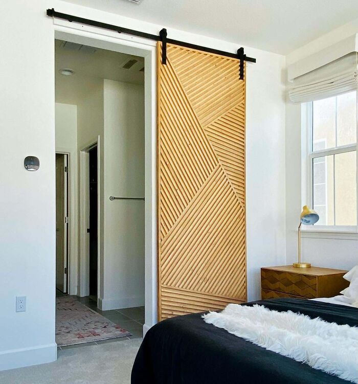 Modern bedroom with creative wooden sliding door design for decoration inspiration.
