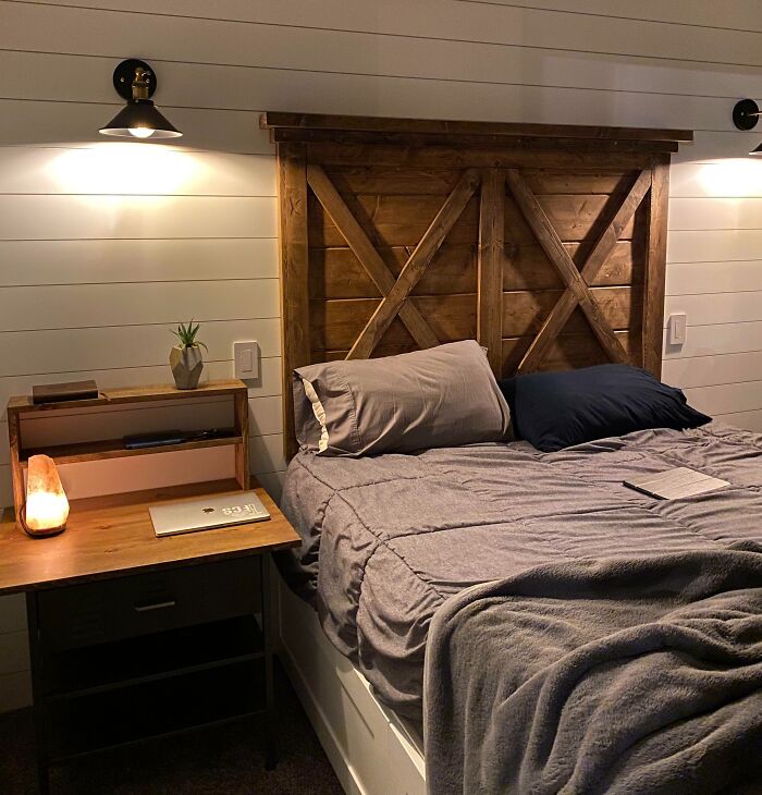Cozy bedroom with a wooden headboard and stylish bed setup for home decoration ideas.