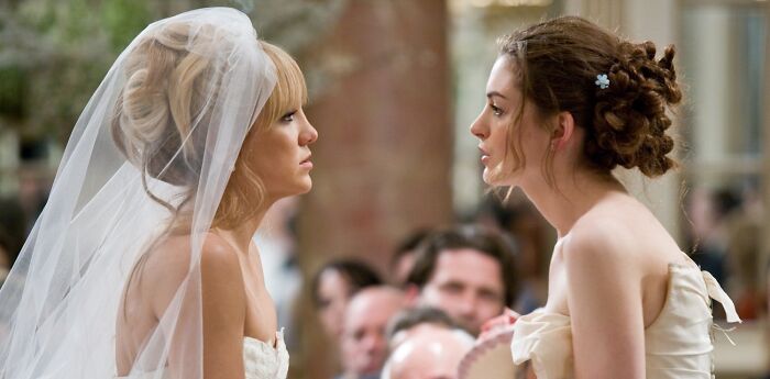 Two brides facing each other, symbolizing iconic best friend duos.
