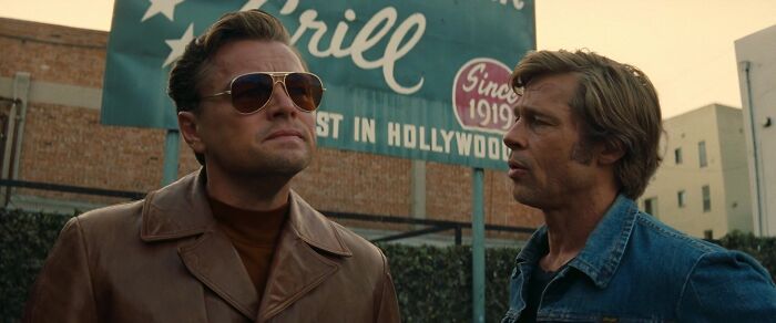 Two men standing outdoors, one in sunglasses and a leather jacket, embodying iconic best friend duos.