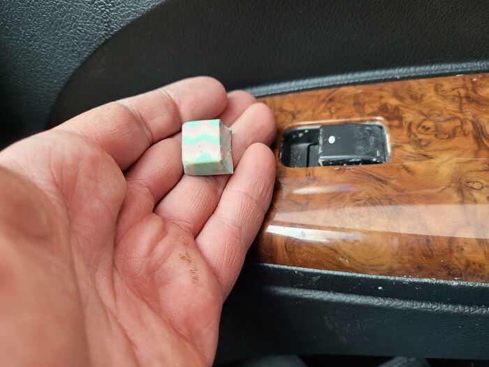 The Piece Of An Eraser That I Cut To Fit My Window Switch So My Dog Would Stop Randomly Rolling Down The Window