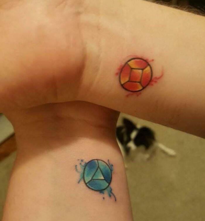 Colorful wrist tattoo designs featuring circular geometric patterns.