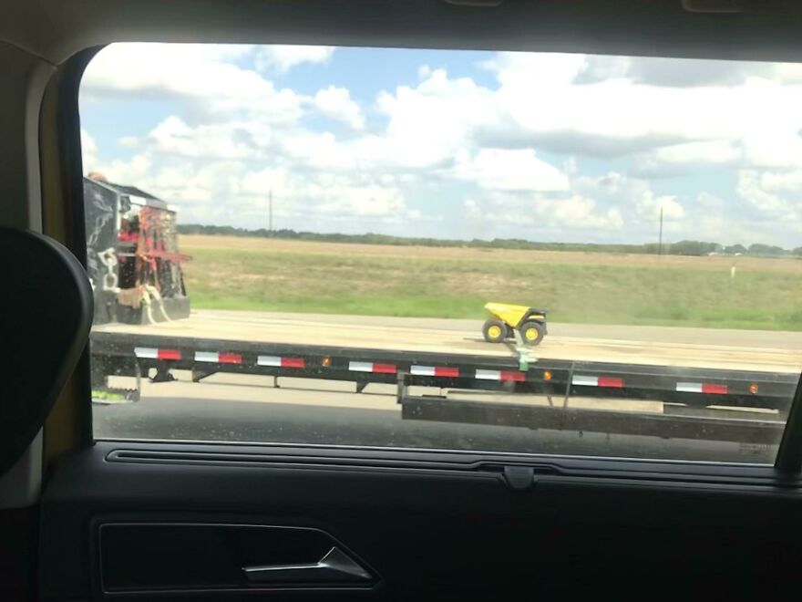 This Truck Carrying A Toy On A Highway This Truck Carrying A Toy On A Highway