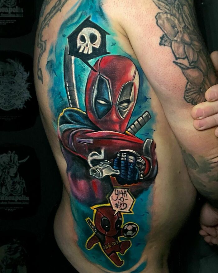 Tattoo of a Marvel character with swords and a skull background on a person's side.
