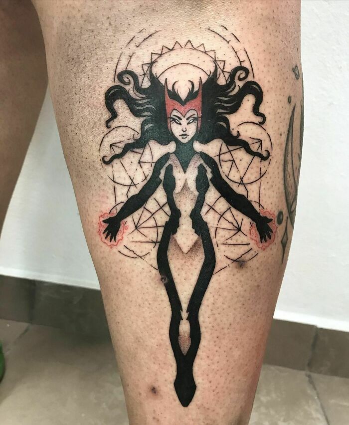 Marvel-inspired Scarlet Witch tattoo featuring a superhero design on a person's leg.