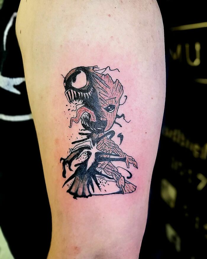Marvel tattoo featuring a unique fusion of Venom and Groot, creatively inked on an arm.