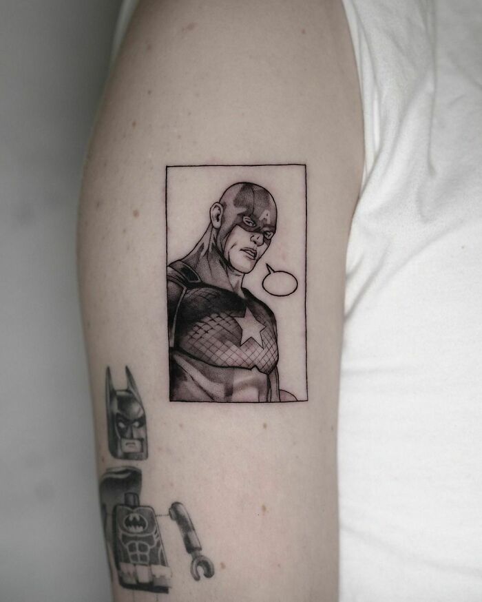 Marvel tattoo featuring Captain America and a Lego Batman design on an arm.