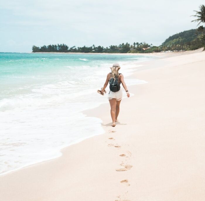 woman walking along the seashore