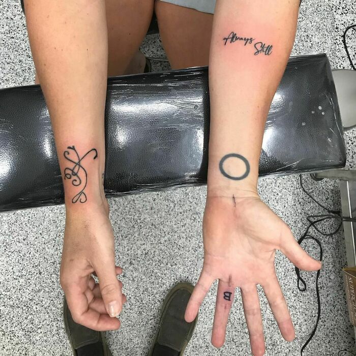 Wrist tattoos with abstract designs and text, showcasing unique ideas for making a statement.