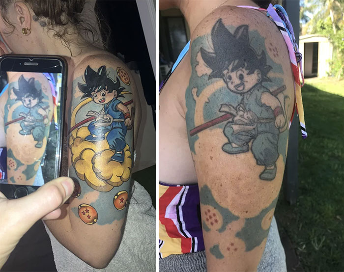 Aged tattoo on an arm showing a cartoon character, highlighting how ink fades over years.