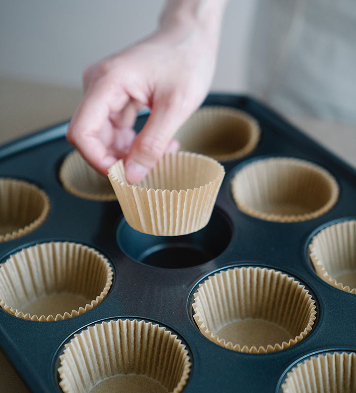 Person holding cupcake liner
