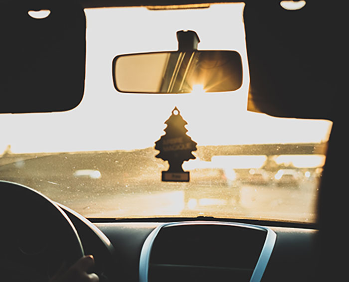 Person driving car during daytime