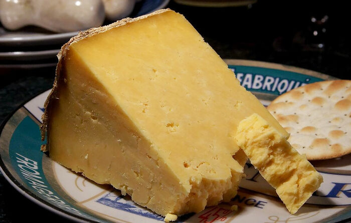 cheese with the cracker on the plate