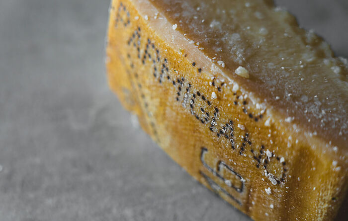 cheese with words parmigiano on it