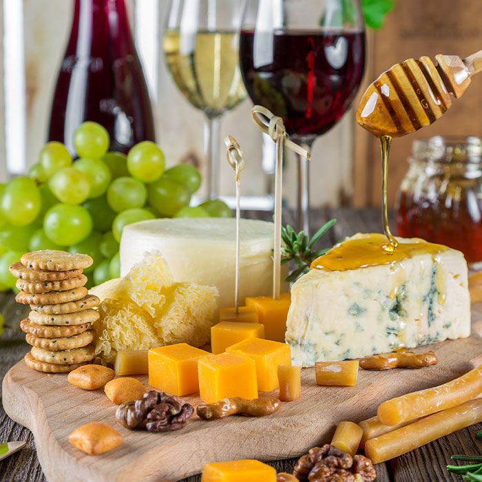 different views of cheese on the wooden board
