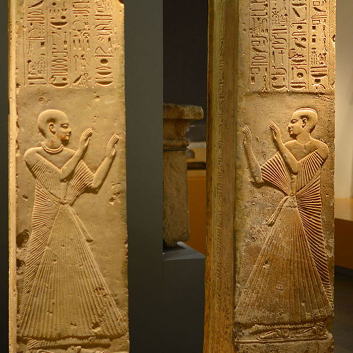 walls with engraving hieroglyphs and mans on it