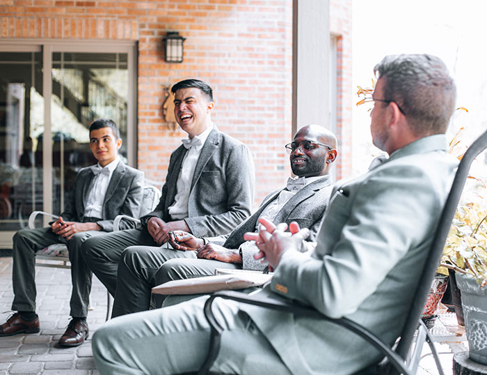 Best mans sitting and laughing