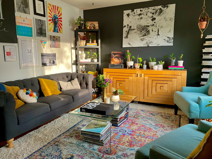 Chic living room with colorful decor, modern art, and plants for creative inspiration in home decoration.