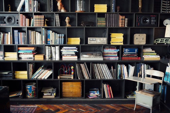 Creative decoration inspiration with a vintage bookshelf filled with colorful books, decor items, and eclectic accessories.