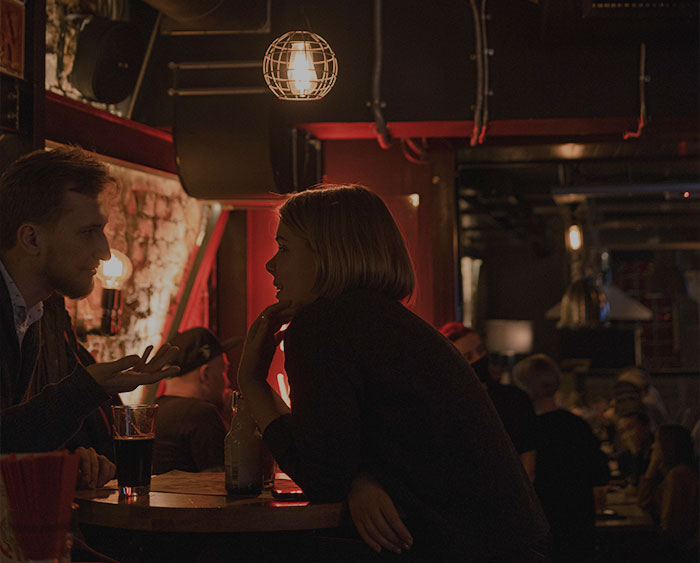 People talking at bar