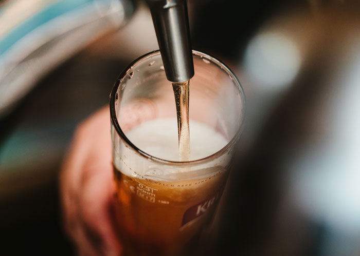 Person pouring a drink 