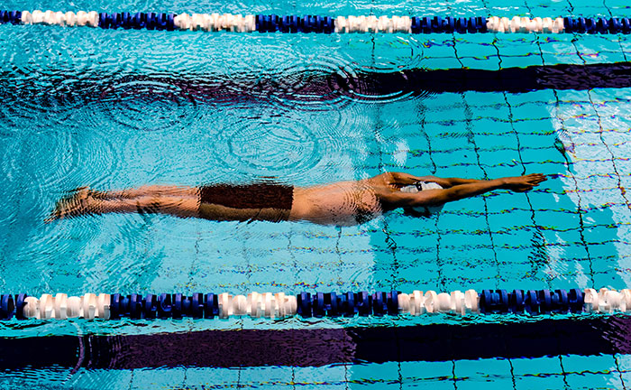 Man swimming in pool