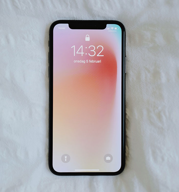 Locked iPhone on a soft surface symbolizing security and privacy, related to fun facts about physics insights.